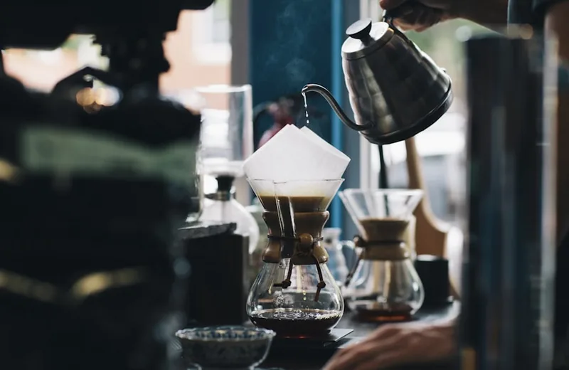 A laptop and coffee on a café table